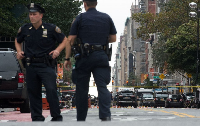 security forces invesitgate at the scene the day after an explosion on new york 039 s west 23rd street on september 18 2016 photo afp