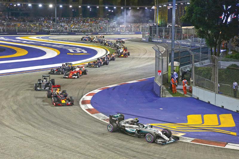 rosberg took full advantage of his pole position to win the singaporean grand prix despite coming under great pressure from ricciardo late on photo reuters