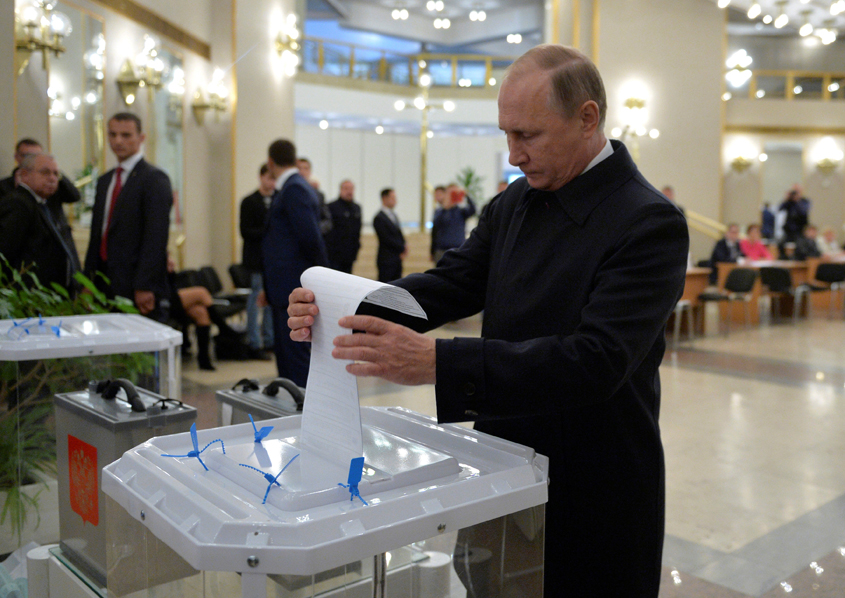 russian president vladimir putin casts a ballot at a polling station during a parliamentary election in moscow russia september 18 2016 photo reuters