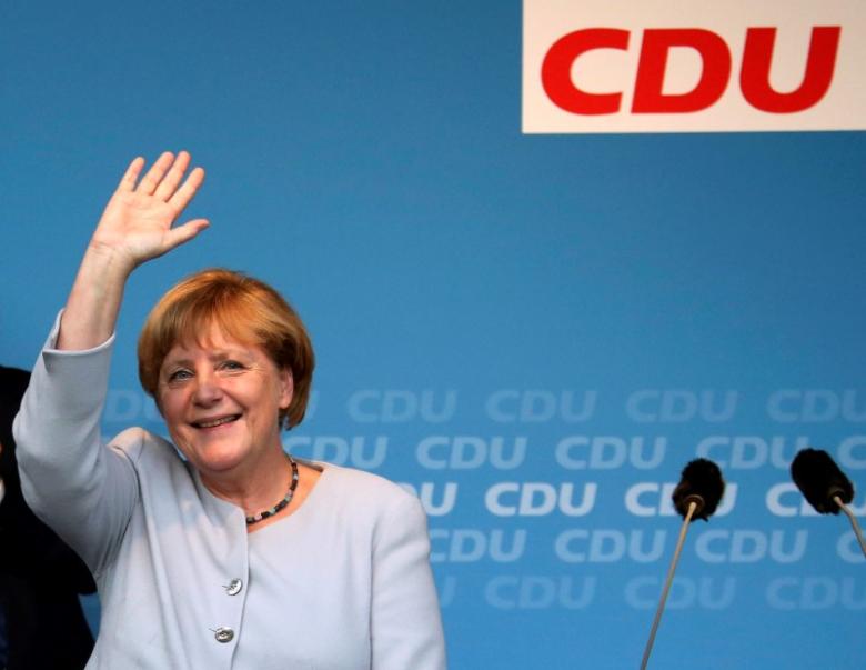 german chancellor and chairwoman of the christian democratic union cdu angela merkel waves during an election campaign rally for local city elections in berlin germany photo reuters