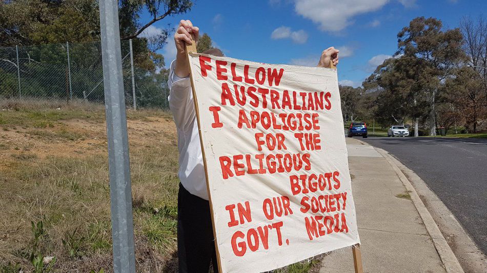 the solitary man stood with his sign of solidarity outside a canberra mosque in australia photo twitter