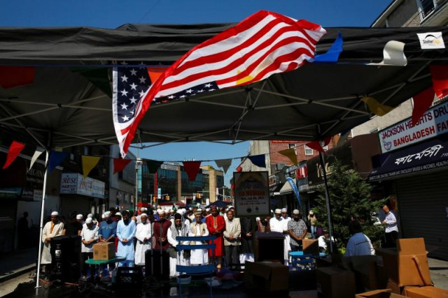 muslim men attend eid al fitr prayers to mark the end of the holy fasting month of ramadan in the queens borough of new york us photo reuters muslim men attend eid al fitr prayers to mark the end of the holy fasting month of ramadan in the queens borough of new york us photo reuters