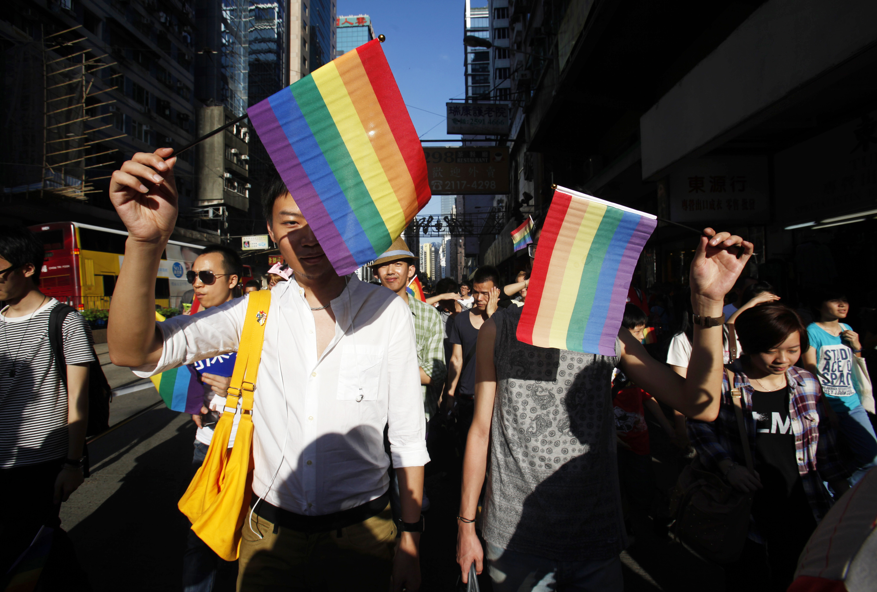 people with gay pride flags take part in a gay pride parade in hong kong november 10 2012 photo reuters