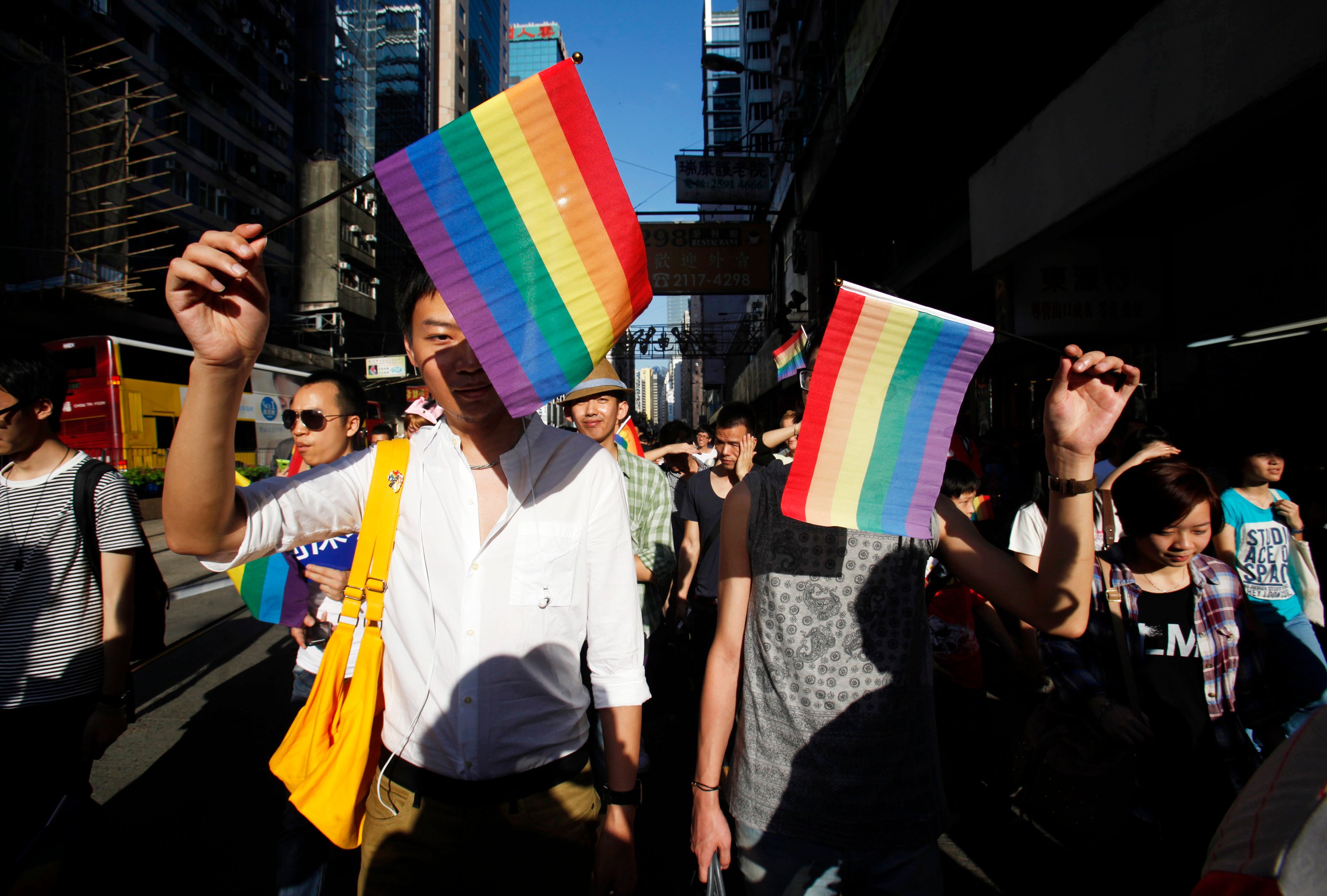 people with gay pride flags take part in a gay pride parade in hong kong november 10 2012 photo reuters