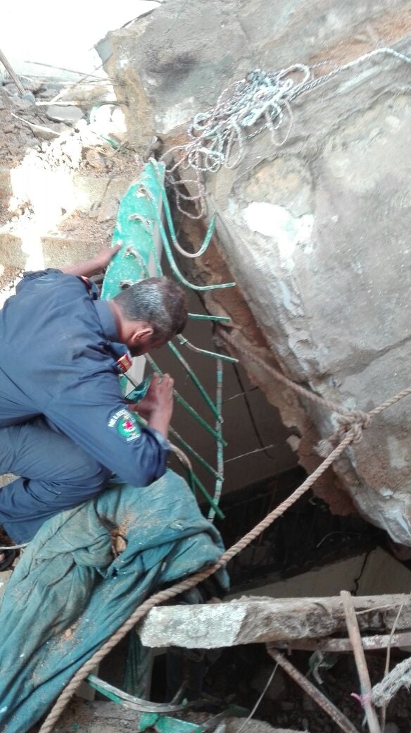 a rescue worker looks at the collapsed roof of a mosque in malir karachi due to which at least two children were killed photo express