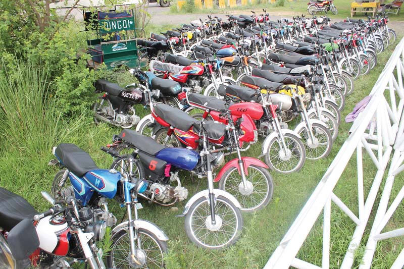 motorcycles impounded by the islamabad police for various traffic violations particularly wheeling are parked outside a police station photo express
