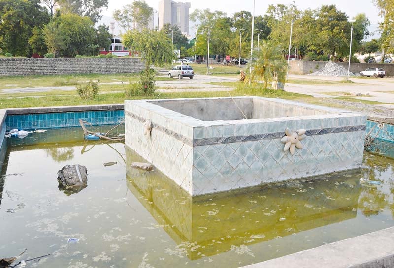 a dysfunctional water fountain in front of poly clinic is a breeding ground of mosquitoes photo mudassir raja express