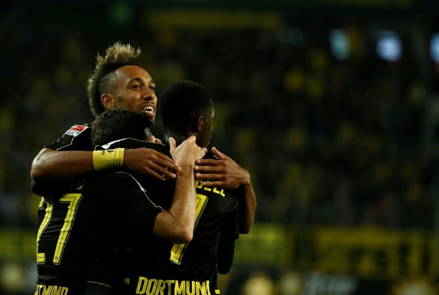 pierre emerick aubameyang c ousmane dembele r and gonzalo castro celebrate at volkswagen arena in wolfsburg on september 20 2016 photo afp pierre emerick aubameyang c ousmane dembele r and gonzalo castro celebrate at volkswagen arena in wolfsburg on september 20 2016 photo afp