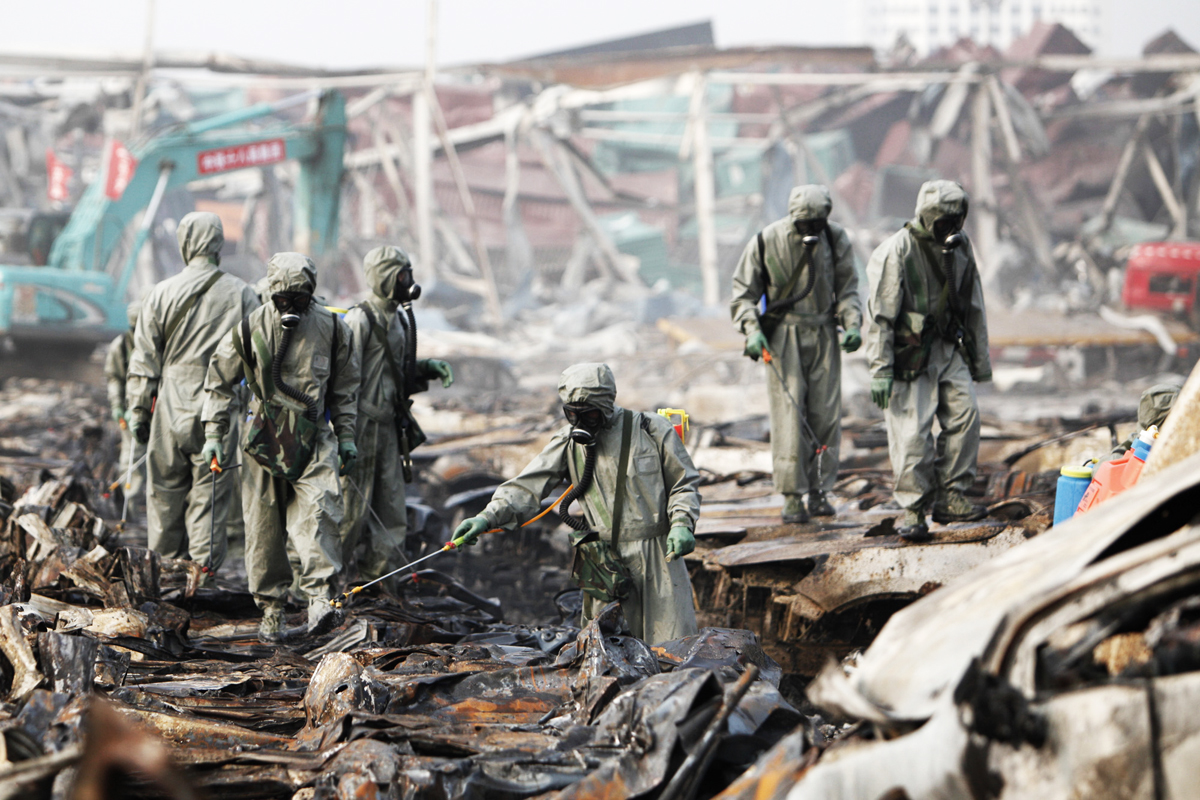 rescuers spray hydrogen peroxide at the site of tianjin warehouse explosion on august 20 2015 in tianjin china photo afp