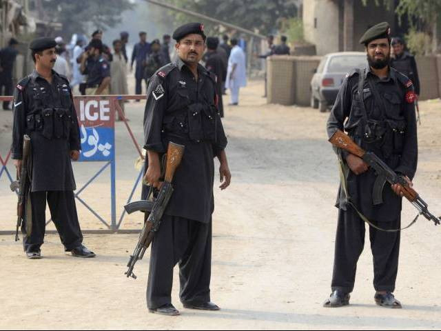 a file photo of policemen standing guard in peshawar photo reuters a file photo of policemen standing guard in peshawar photo reuters