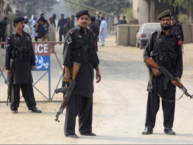 a file photo of policemen standing guard in peshawar photo reuters