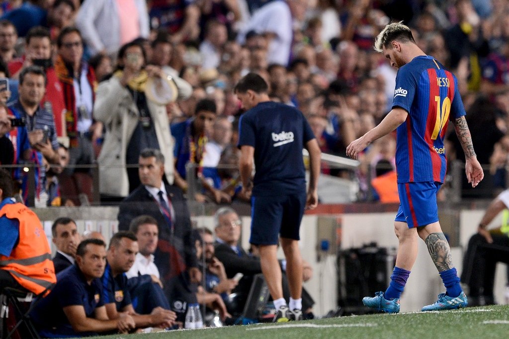 lionel messi walks back to the dugout at the camp nou stadium in barcelona on september 21 2016 photo afp