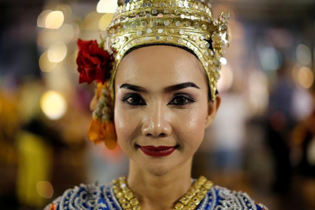 a thai classical dancer poses for photos at the erawan shrine in central of bangkok thailand photo reuters a thai classical dancer poses for photos at the erawan shrine in central of bangkok thailand photo reuters