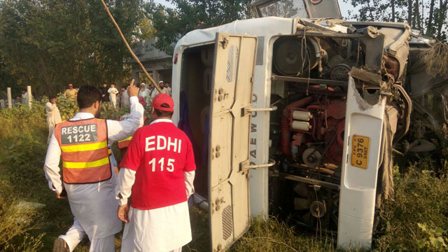 rescuers are busy shifting injured passengers from a site near charsadda interchange where a peshawar bound bus overturned on wednesday september 22 2016 photo express