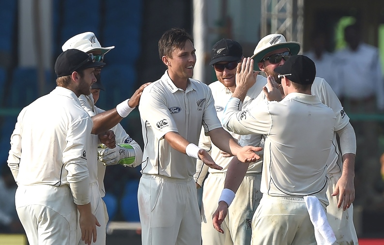 new zealand 039 s trent boult c celebrates the wicket of india 039 s wriddhiman saha with teammates during the first day of the first test match between india and new zealand at green park stadium in kanpur on september 22 2016 photo afp