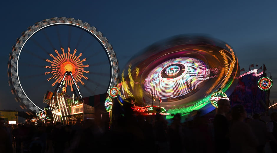 people ride the chair swing at the theresienwiese oktoberfest fair grounds in munich southern germany photo afp