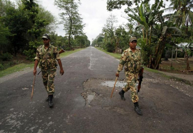 security personnel patrol a deserted road during a curfew in baksa district in assam may 4 2014 photo reuters security personnel patrol a deserted road during a curfew in baksa district in assam may 4 2014 photo reuters