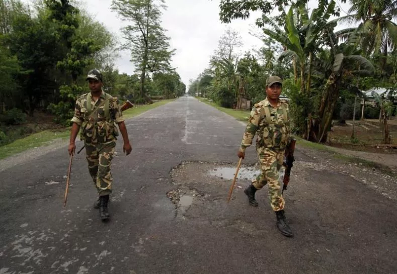 security personnel patrol a deserted road during a curfew in baksa district in assam may 4 2014 photo reuters security personnel patrol a deserted road during a curfew in baksa district in assam may 4 2014 photo reuters