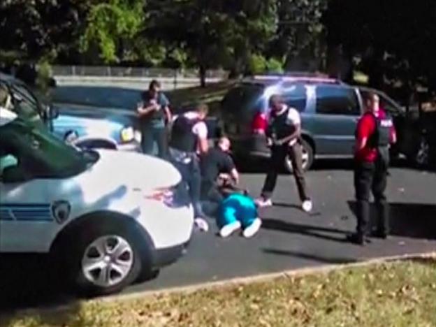 keith scott lies on the ground after being fatally shot by police in charlotte north carolina us in this still image taken from video received by reuters september 23 2016 photo reuters