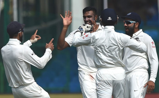 india 039 s captain viral kohli l and ravichandran ashwin 2nd l celebrate the wicket of new zealand 039 s captain kane williamson during the third day of the first cricket test match between india and new zealand at green park stadium in kanpur on september 24 2016 photo afp