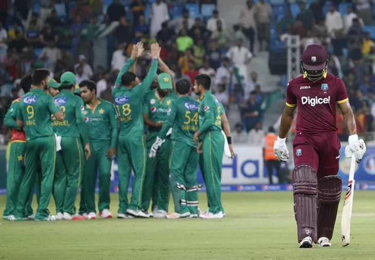 west indies player marlon samuels r walks as pakistan 039 s players celebrate taking a wicket during the t20i match between pakistan and west indies at the dubai international cricket stadium on september 24 2016 photo afp west indies player marlon samuels r walks as pakistan 039 s players celebrate taking a wicket during the t20i match between pakistan and west indies at the dubai international cricket stadium on september 24 2016 photo afp