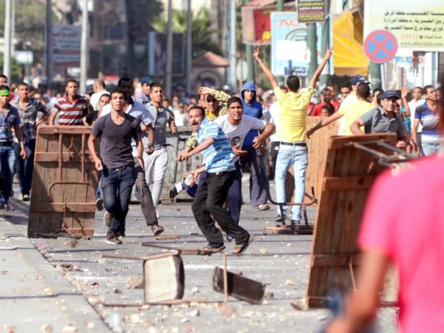 supporters of the muslim brotherhood and ousted president mohamed mursi clash with opponents in alexandria photo afp file