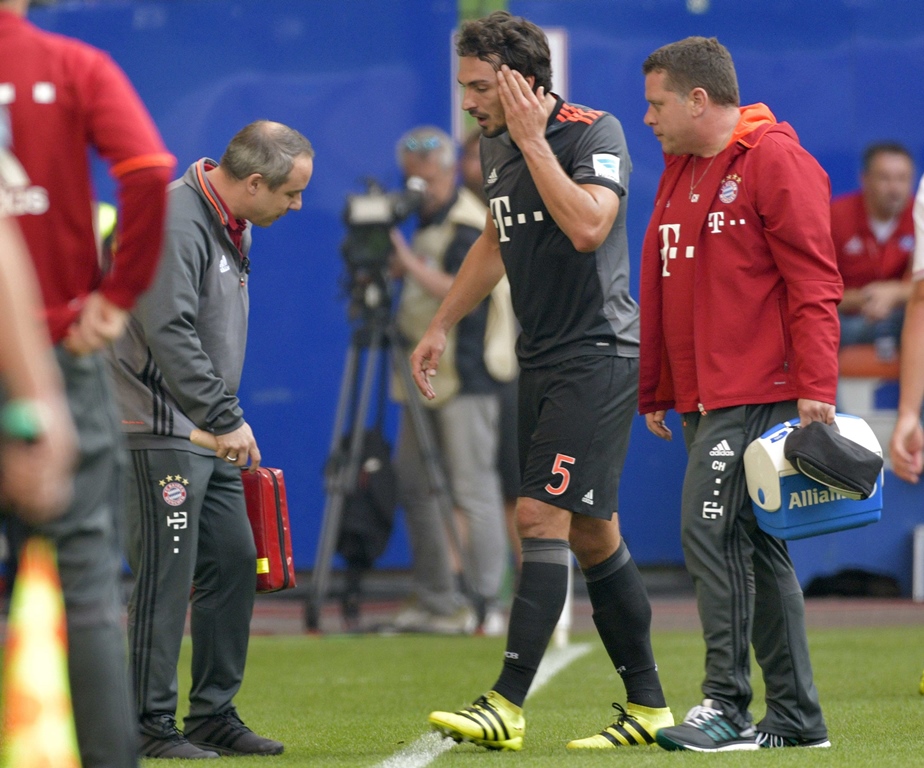 mats hummels is escorted off the pitch after an injury photo reuters