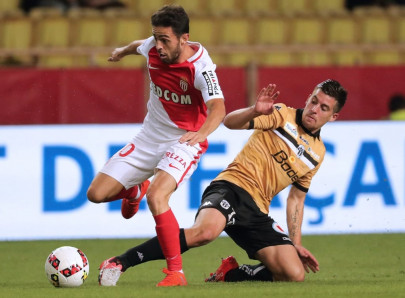 monaco grind out win to go top