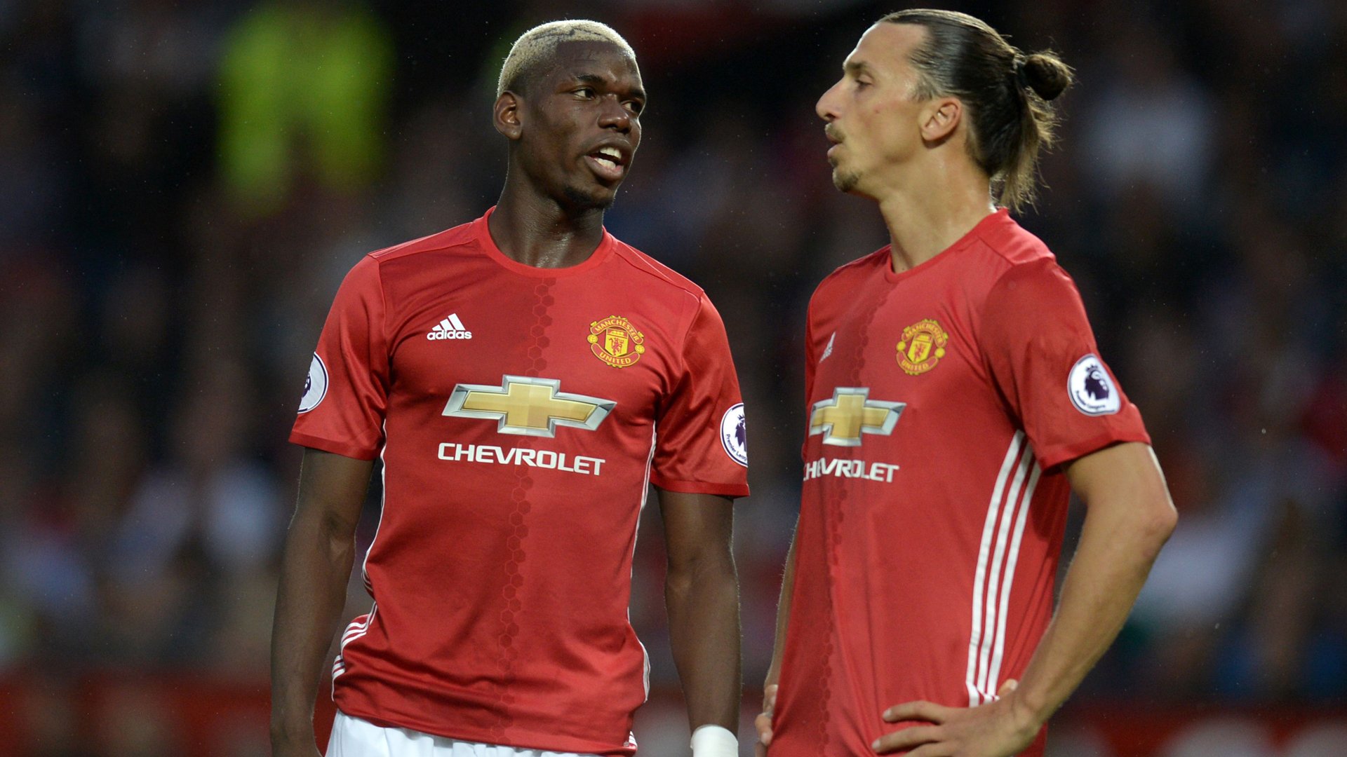 zlatan ibrahimovic r speaks with paul pogba at old trafford on august 19 2016 photo afp