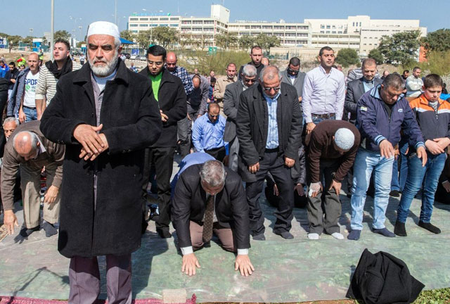 file photo of an israeli muslim cleric leading prayer in support for the release of mohammed al qiq a palestinian prisoner on hunger strike photo afp