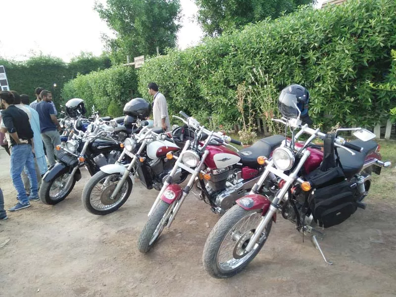 vintage motorcycles lined by the roadside photo ammar sheikh express vintage motorcycles lined by the roadside photo ammar sheikh express
