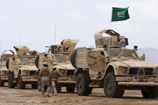 saudi troops walk past armoured personnel carriers at their base in yemen 039 s southern port city of aden september 28 2015 photo reuters