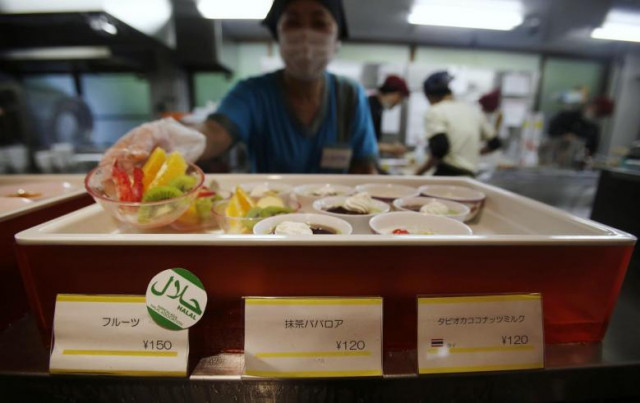 a staff shows a bowl of cut fruit above a quot halal certified quot sign photo reuters a staff shows a bowl of cut fruit above a quot halal certified quot sign photo reuters