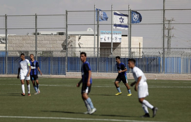 beitar maale adumim football club team play against ironi modiin football club during an israeli league match at the maale adumim stadium in the israeli west bank settlement of maale adumin on september 23 2016 fifa has been condoning football matches played on quot stolen quot land in the occupied west bank human rights watch said on september 26 2016 calling for israeli clubs based in settlements to be forced to relocate six clubs in the israeli football league play in west bank jewish settlements which are considered illegal under international law the report said photo afp beitar maale adumim football club team play against ironi modiin football club during an israeli league match at the maale adumim stadium in the israeli west bank settlement of maale adumin on september 23 2016 fifa has been condoning football matches played on quot stolen quot land in the occupied west bank human rights watch said on september 26 2016 calling for israeli clubs based in settlements to be forced to relocate six clubs in the israeli football league play in west bank jewish settlements which are considered illegal under international law the report said photo afp