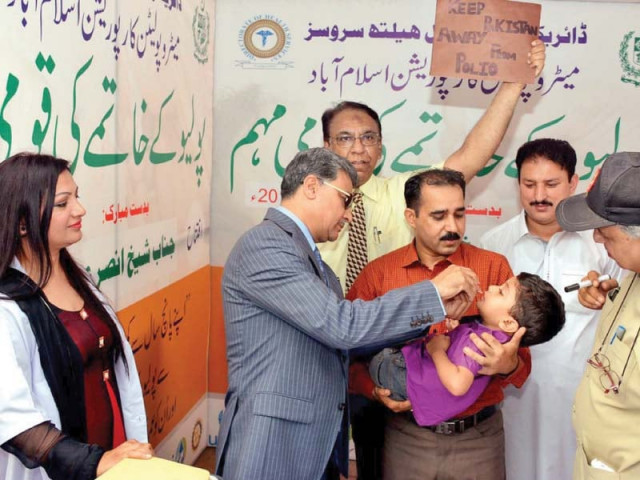 islamabad mayor anser aziz administers anti polio drops to a child to mark the start of the inoculation campaign in the capital photo inp islamabad mayor anser aziz administers anti polio drops to a child to mark the start of the inoculation campaign in the capital photo inp