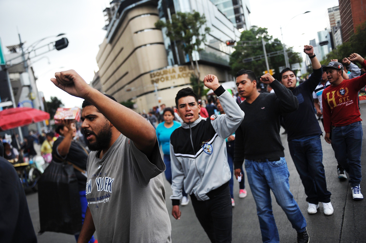 students and relatives of the 43 missing students from ayotzinapa take part in a protest in mexico city on september 26 2016 to commemorate the second anniversary of their disappearance photo afp