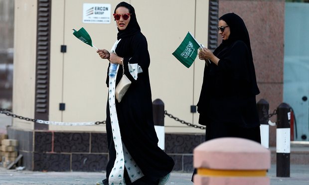 saudi women hold national flags during saudi national day in riyadh saudi arabia friday photo reuters