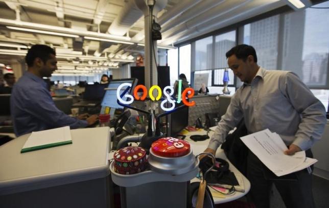 a neon google logo is seen as employees work at the new google office in toronto november 13 2012 photo reuters