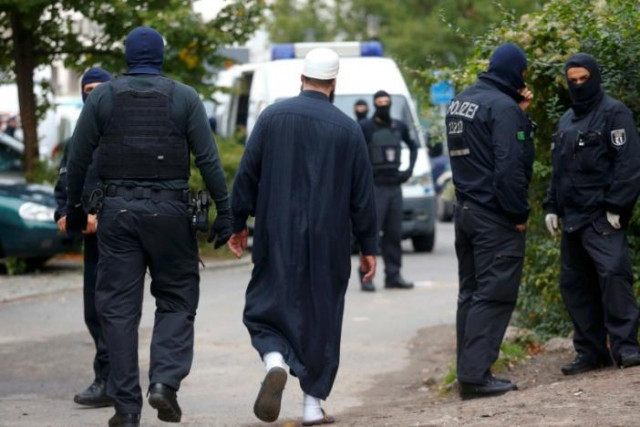 german special police members walk near a mosque association property in berlin germany september 22 2015 photo reuters german special police members walk near a mosque association property in berlin germany september 22 2015 photo reuters
