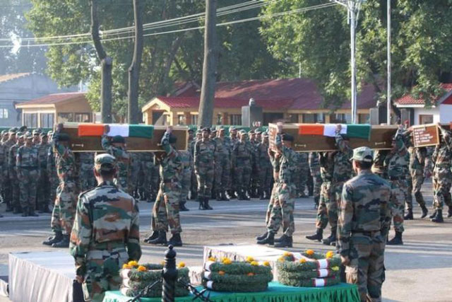 indian army soldiers carry the coffins of their colleagues who were killed after gunmen attacked an indian army base in kashmir 039 s uri on sunday during a wreath laying ceremony in srinagar september 19 2016 photo reuters