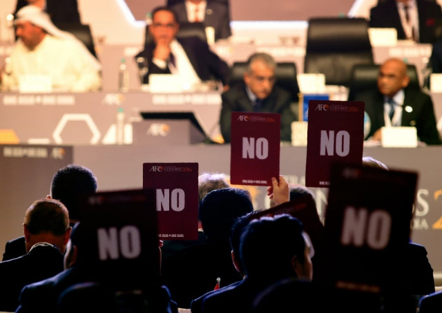 members of the asian football confederation afc hold up 039 no 039 voting cards in goa on september 27 2016 photo afp