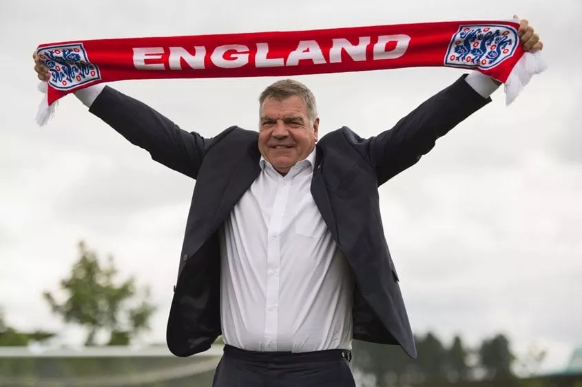 this file photo taken on july 25 2016 shows england football team manager sam allardyce holding up an england scarf during a photocall at st george 039 s park near burton on trent central england photo afp this file photo taken on july 25 2016 shows england football team manager sam allardyce holding up an england scarf during a photocall at st george 039 s park near burton on trent central england photo afp