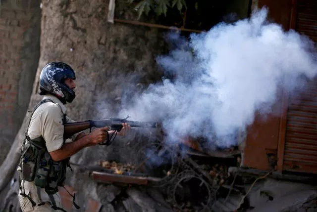 an indian policeman fires a teargas shell towards demonstrators during a protest against the recent killings in kashmir in srinagar september 23 2016 photo reuters an indian policeman fires a teargas shell towards demonstrators during a protest against the recent killings in kashmir in srinagar september 23 2016 photo reuters