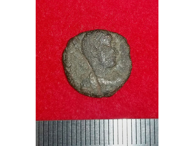 this handout photo released on september 26 2016 by the uruma city municipal office and received via jiji press on september 28 shows a 4th century copper coin from ancient rome after it was unearthed in japan 039 s okinawa island together with other coins photo afp