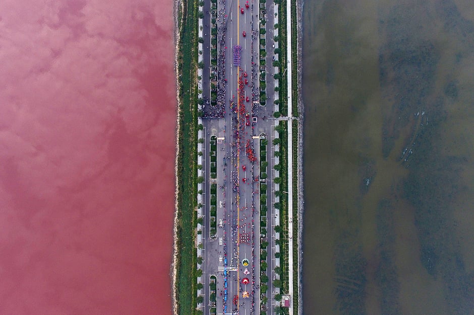 a salt lake which is separated by a road shows parts of it in different colours due to the algae in yuncheng shanxi province china photo reuters