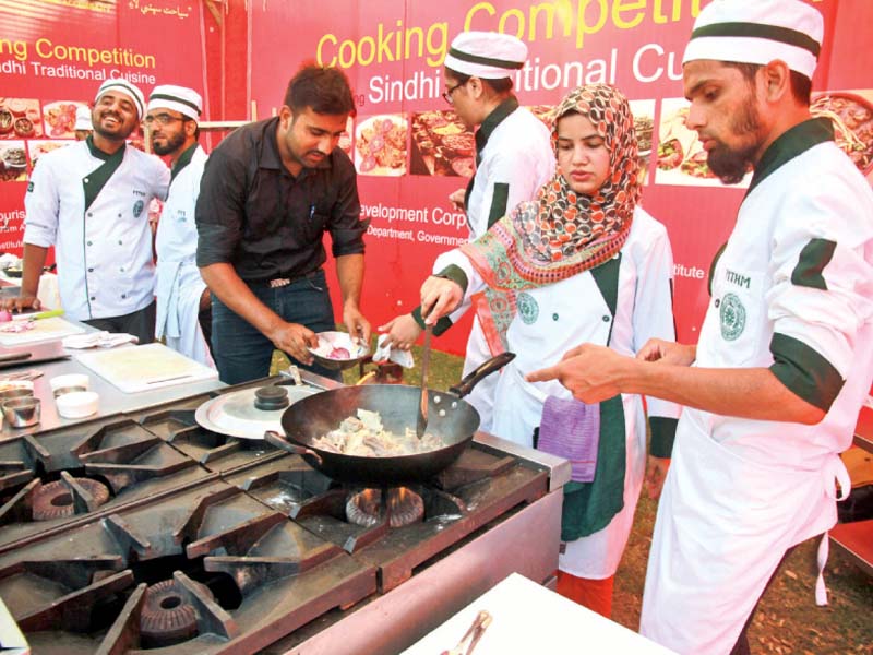 pithm students prepare mutton karahi while taking part in the cooking competition photo athar khan express