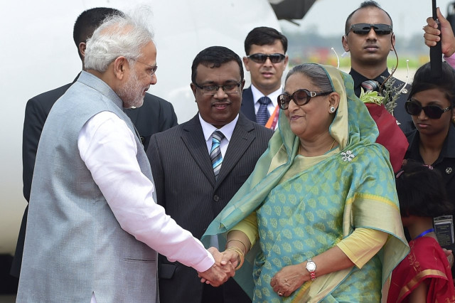 bangladeshi prime minister sheikh hasina wajid r welcomes her indian counterpart narendra modi l at the hazrat shahjalal international airport in dhaka on june 6 2015 photo afp bangladeshi prime minister sheikh hasina wajid r welcomes her indian counterpart narendra modi l at the hazrat shahjalal international airport in dhaka on june 6 2015 photo afp