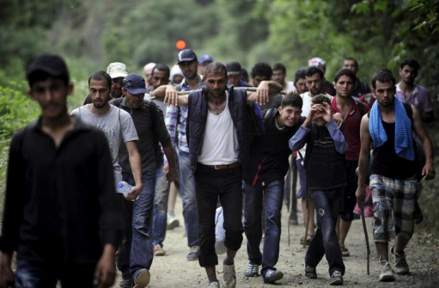 migrants from syria walk in macedonia near the greek border june 17 2015 photo reuters migrants from syria walk in macedonia near the greek border june 17 2015 photo reuters