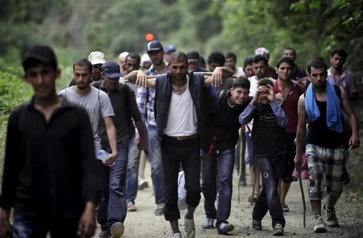 migrants from syria walk in macedonia near the greek border june 17 2015 photo reuters