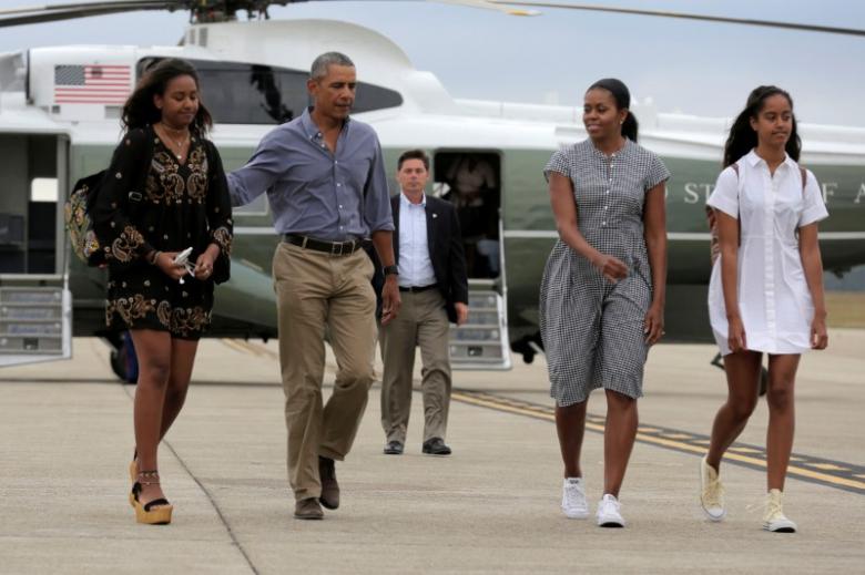 us president barack obama us first lady michelle obama and their daughters malia r and sasha l board air force one at cape cod coast guard air station photo reuters